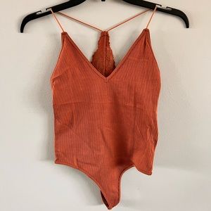 Dynamic seamless bodysuit! One size. So comfortable! Lace detail on the back.